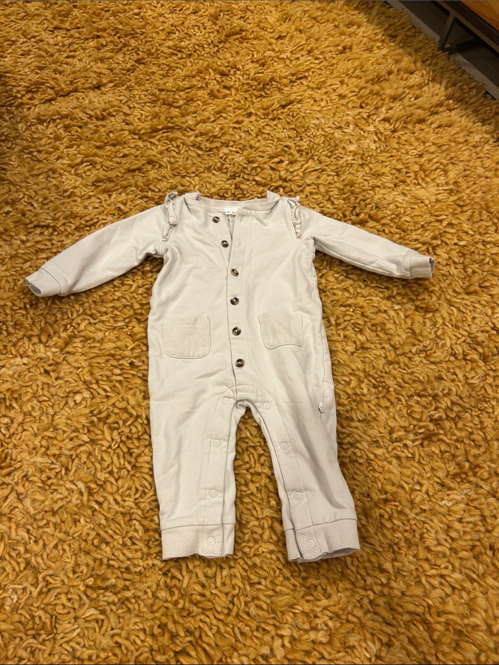 FIRSTS by Petit Lem onesie
